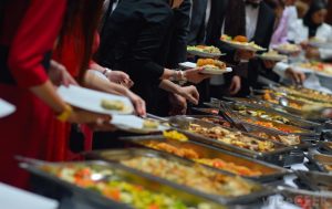 Guests in A Buffet Line of a Corporate Event organized by Event Management Service Kiyoh